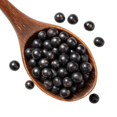Dark berries in wooden spoon