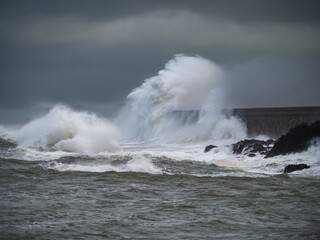 crashing waves over Holyhead breakwater isle of Anglesey
