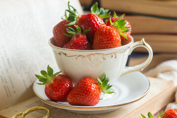 Delicate pancakes with fruits and berries on a wooden table.