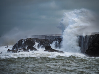 crashing waves over Holyhead breakwater isle of Anglesey