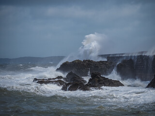 crashing waves over Holyhead breakwater isle of Anglesey