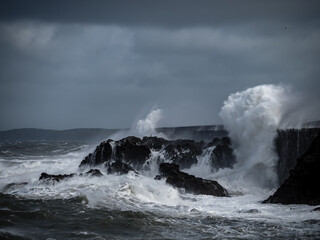crashing waves over Holyhead breakwater isle of Anglesey