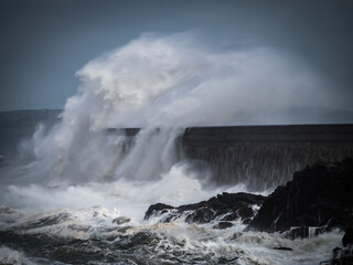 crashing waves over Holyhead breakwater isle of Anglesey