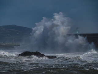 crashing waves over Holyhead breakwater isle of Anglesey