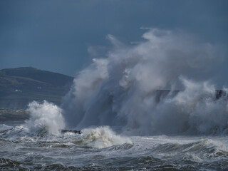 crashing waves over Holyhead breakwater isle of Anglesey