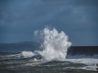 crashing waves over Holyhead breakwater isle of Anglesey