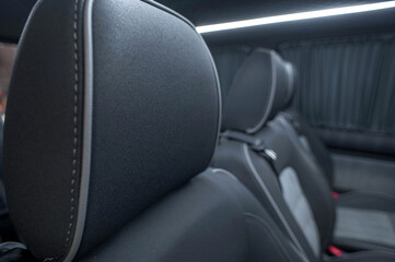 Comfortable interior of a passenger bus with soft seats