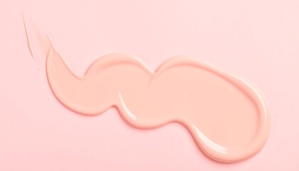 Light peach cream smudged on a pink background