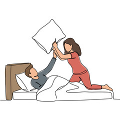 Young couple having playful pillow fight in bed at home  