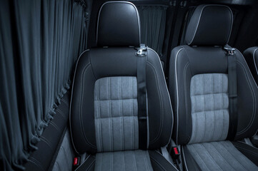 Fototapeta premium Comfortable interior of a passenger bus with soft seats