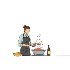 Woman preparing a romantic dinner while cooking in a kitchen  
