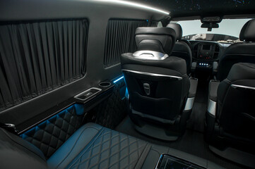 Comfortable interior of a passenger bus with soft seats
