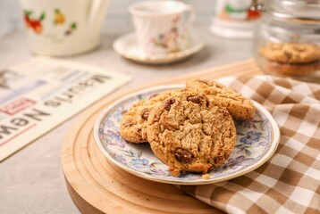 Milk chocolate cookies on the table with blur background