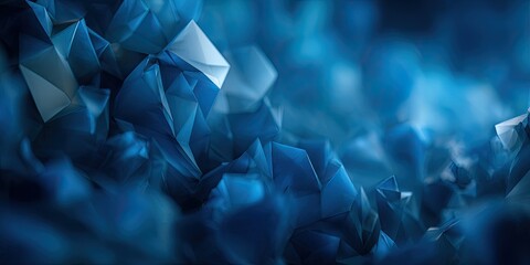An abstract image with a deep blue hue featuring a cluster of crystalline, geometric shapes