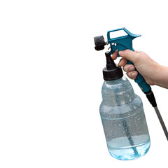 Hand holding a garden sprayer bottle with clear liquid isolated on transparent background for pest control