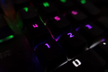 rgb lighting mechanical keyboard in dark and moody environment