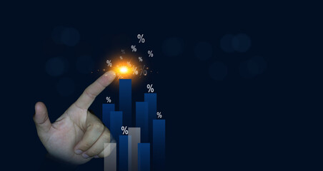 Glowing percentage symbol with hand pointing on a financial bar chart representing interest, growth...