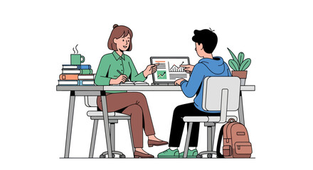 Two people collaborating at a desk with a laptop and books.