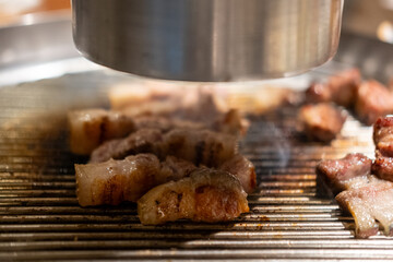 Samgyupsal, a popular Korean dish consisting of thick, sliced pork belly cooked on the grill