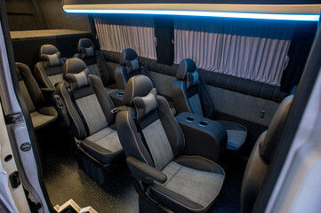 Fototapeta premium Comfortable interior of a passenger bus with soft seats