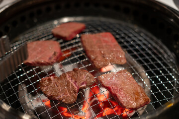 Hanwoo Beef, marbled Korean Style Meat on the Grill. BBQ rare meat with soft focus
