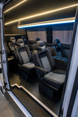 Fototapeta premium Comfortable interior of a passenger bus with soft seats