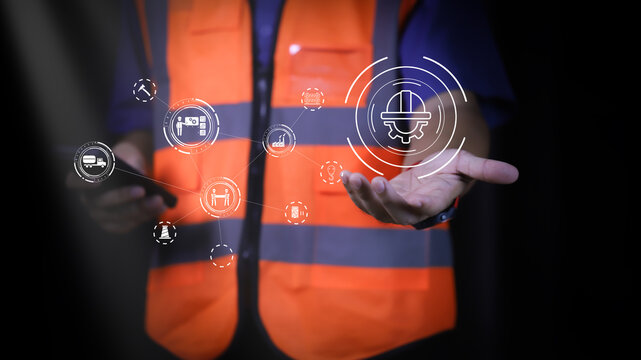 "A construction worker holding a phone with floating digital icons above. The image highlights the integration of technology in construction, focusing on tools, safety, and monitoring systems.