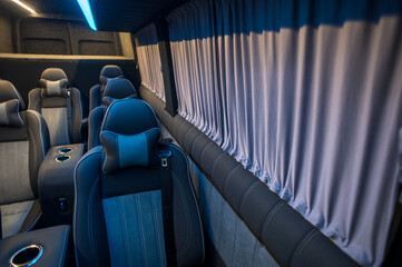 Fototapeta premium Comfortable interior of a passenger bus with soft seats