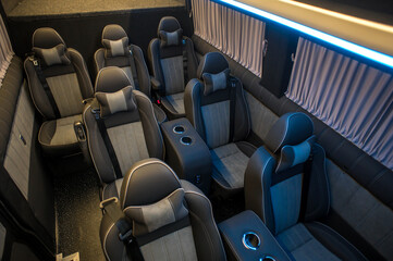 Fototapeta premium Comfortable interior of a passenger bus with soft seats