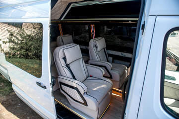 Fototapeta premium Comfortable interior of a passenger bus with soft seats