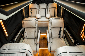 Fototapeta premium Comfortable interior of a passenger bus with soft seats