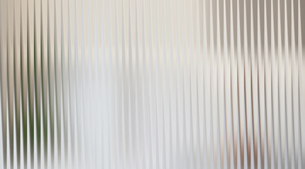 Fototapeta premium Abstract light gray ribbed background with soft light reflections