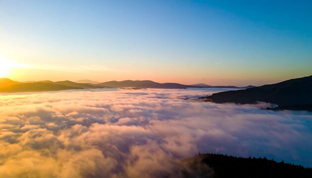 Sunrise over a sea of clouds and mountains - Powered by Adobe