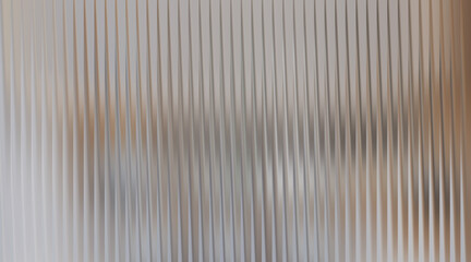 Fototapeta premium Textured abstract background with vertical ribbed pattern and warm lighting