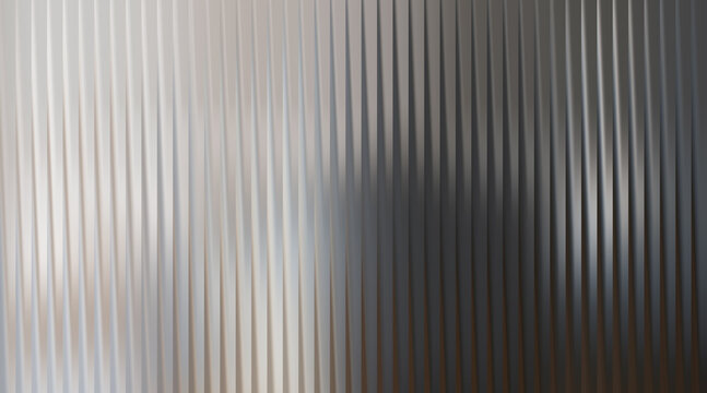 Light abstract vertical ribbed glass texture with soft light and shadow