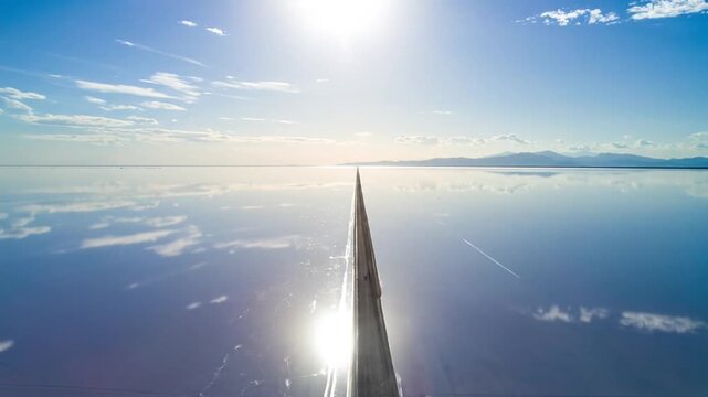 Aerial View of a Plane Wing Over a Vast Body of Water.
