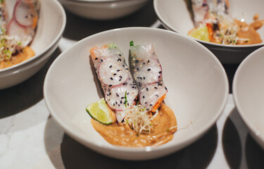Asian rolls with sauces on a plate