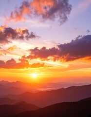Obraz premium Sunrise over mountain peaks