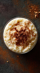A delectable bowl of rice pudding sprinkled with cocoa powder and cinnamon
