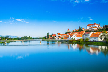 Fototapeta premium Beautiful cityscape of city of Ptuj, reflection in Drava river, Slovenia