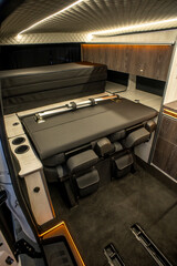 Comfortable interior of a passenger bus with soft seats