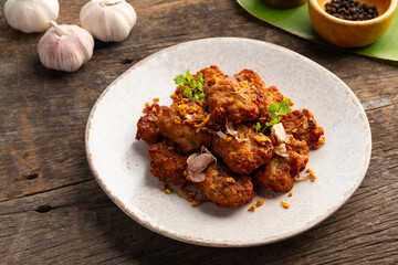 Fried Pork Balls(minced pork) with Garlic and Pepper in white plate.