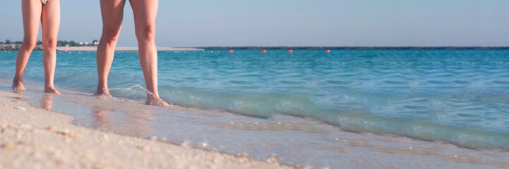 Parent and Child Walking at the Beach Together