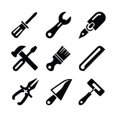 Collection of black silhouette icons of various hand tools on white background vector