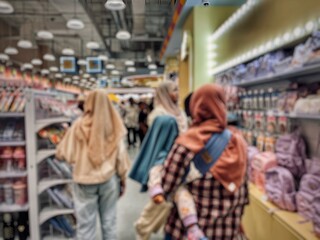 Atmosphere of busy visitors on the ground floor of a mall in Surabaya