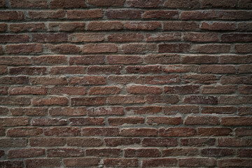 A brick wall with a brown color