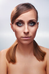 Fototapeta premium Close-Up Portrait of a Woman with Smoky Eyes and a Neutral Expression