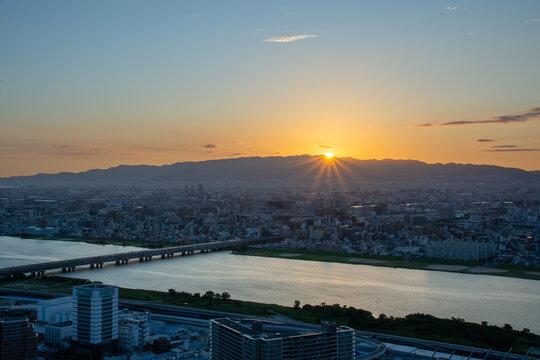 Sunset over Osaka skyline and Yodo River, Japan