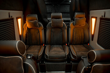 Comfortable interior of a passenger bus with soft seats