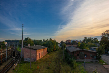 Railway tracks and two old brick buildings in Tarnowskie Góry, Poland
